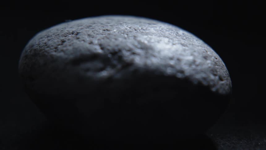 A rock spins around and around before stopping