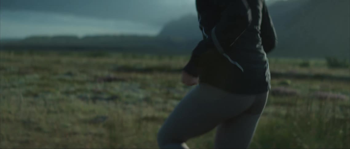 A woman running in slow motion outdoors