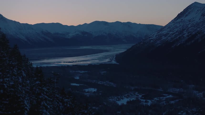 A snowy valley at sunrise