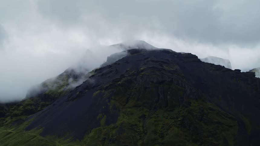 An aerial view of a cloudy mountaintop