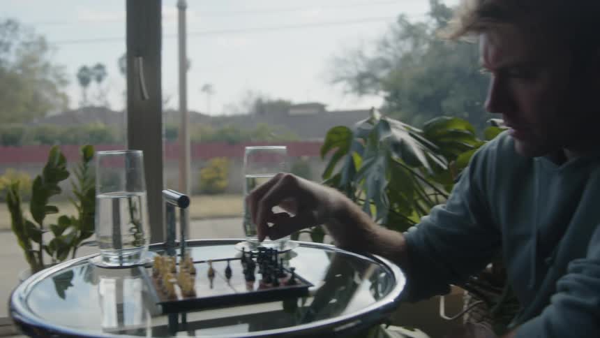 Two men playing chess with each other