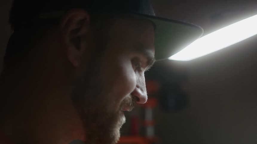 A man is repairing a machine