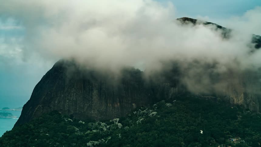 The clouds flow over the island mountain