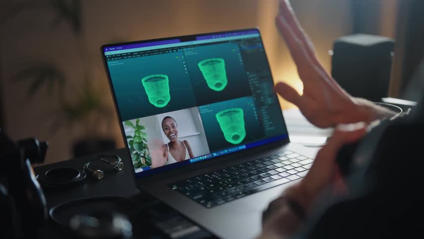 A woman is talking on the computer monitor