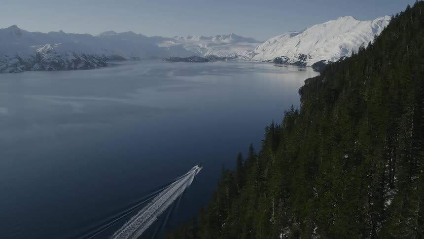 A boat travels across a river