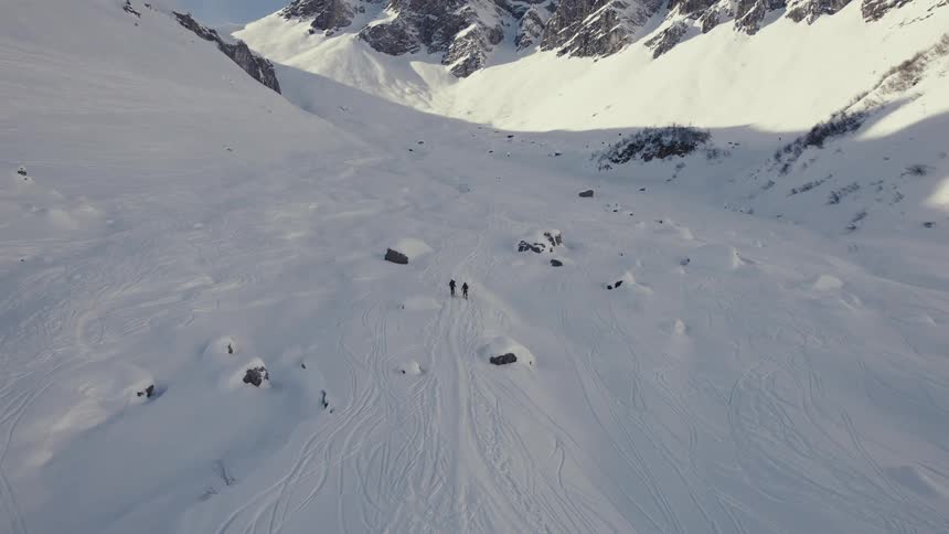 A snow covered mountain is displayed at midday