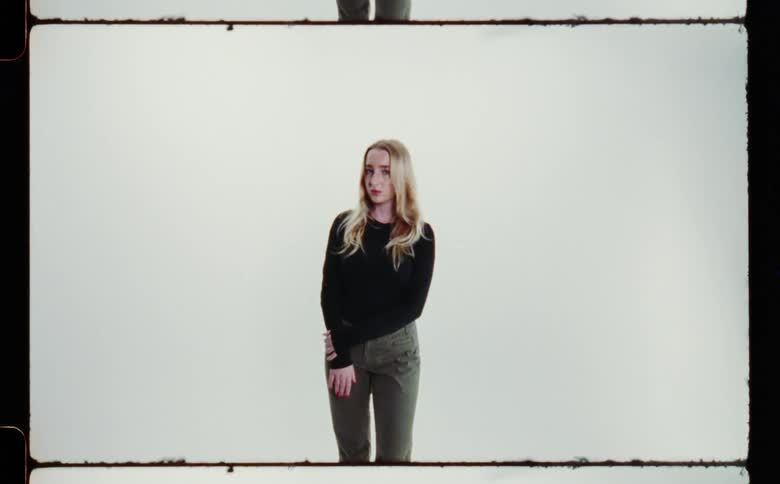 A woman is posing in the film slide