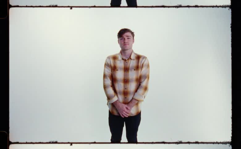 A man is posing in the slide