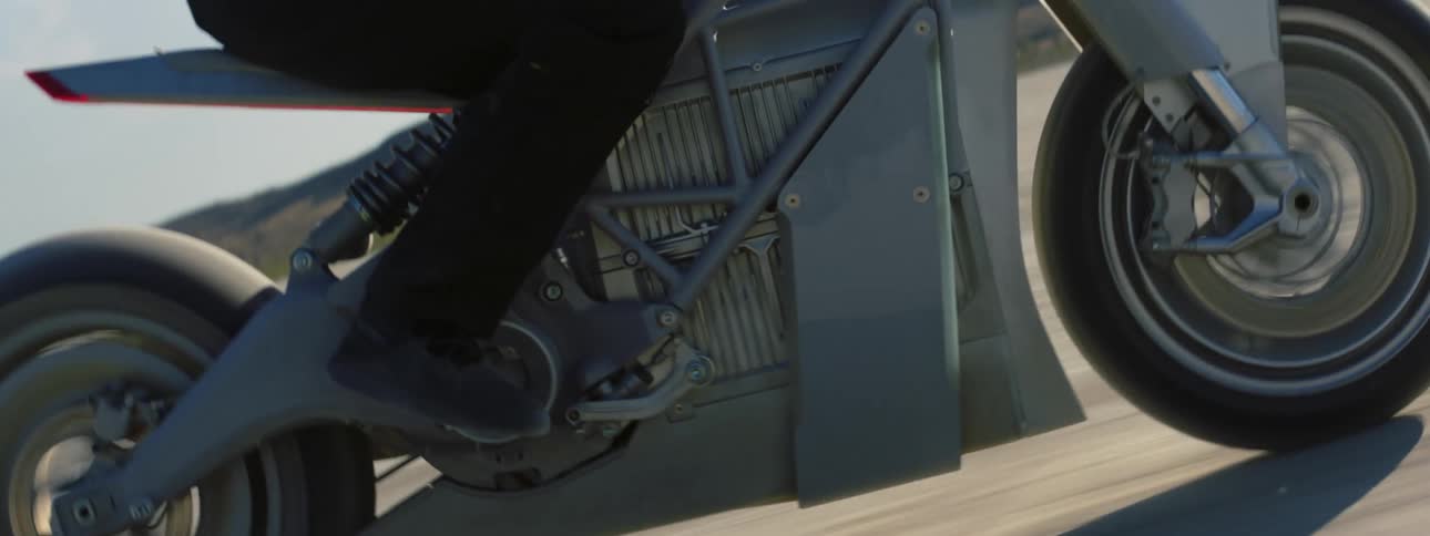 Close up view of a person riding a motorcycle is displayed
