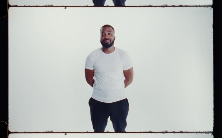 A man is smiling and posing for the camera