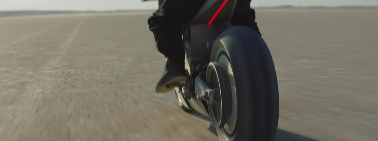 A person is speeding through the desert