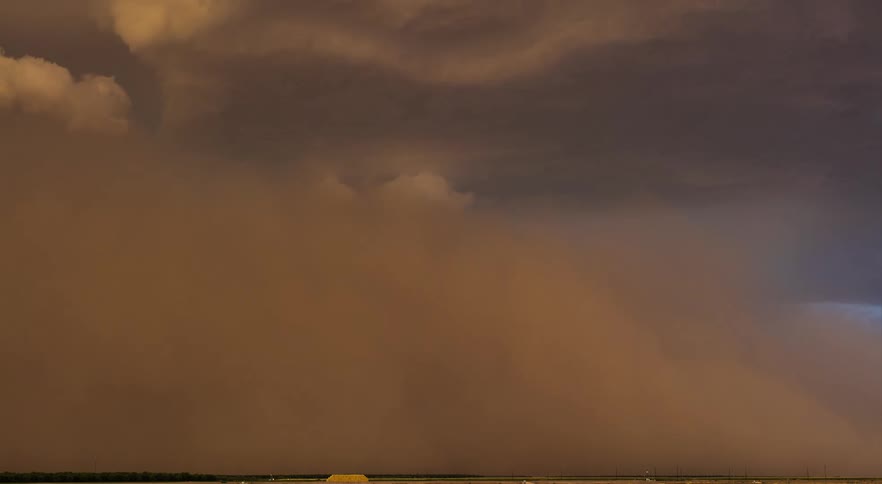 Dust storm moves across farm lands