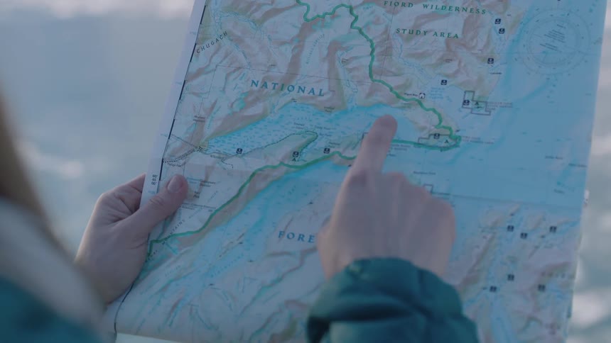 A person points at a map