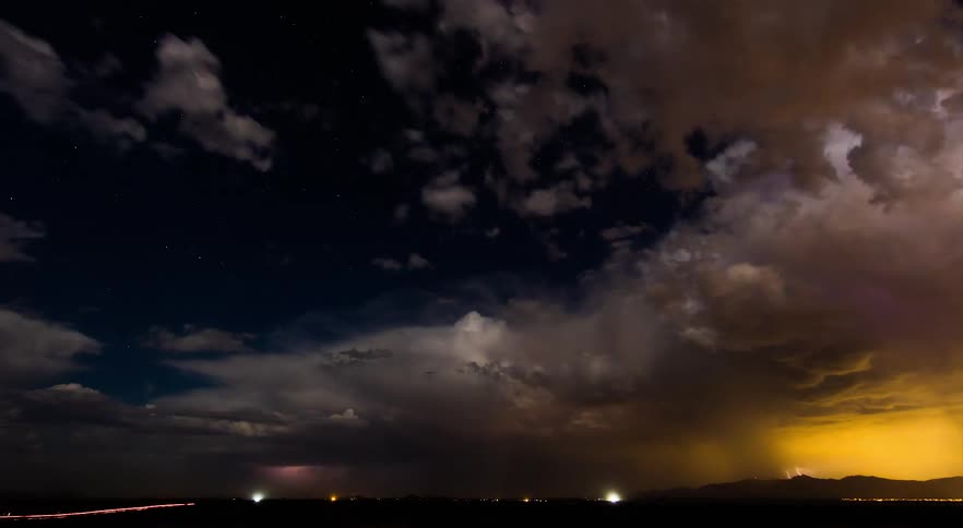A storm with lightning and dark clouds rolling over the sky