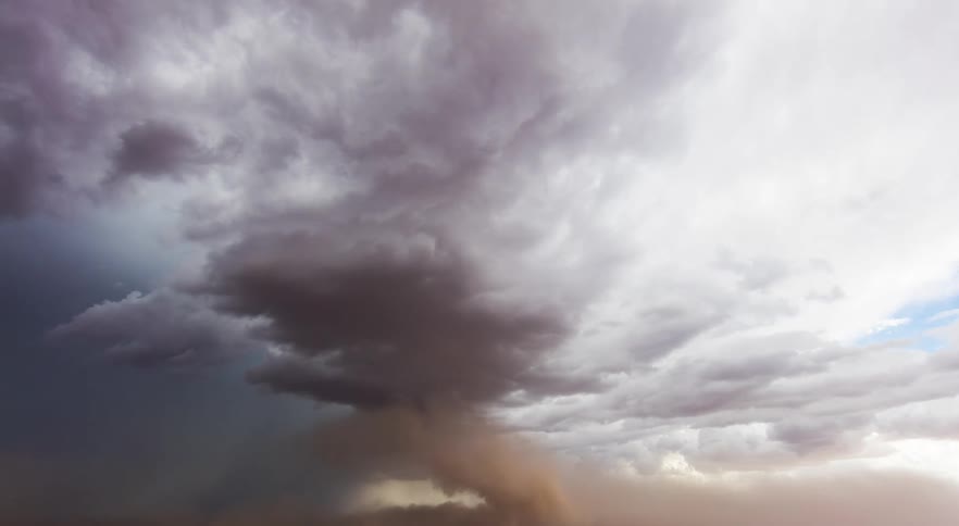 A storm pushes a bunch of dust out ahead of it