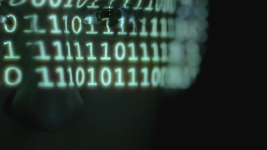 Numbers flash on a man's face
