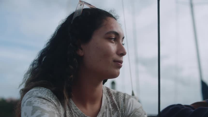 A woman is smiling outside