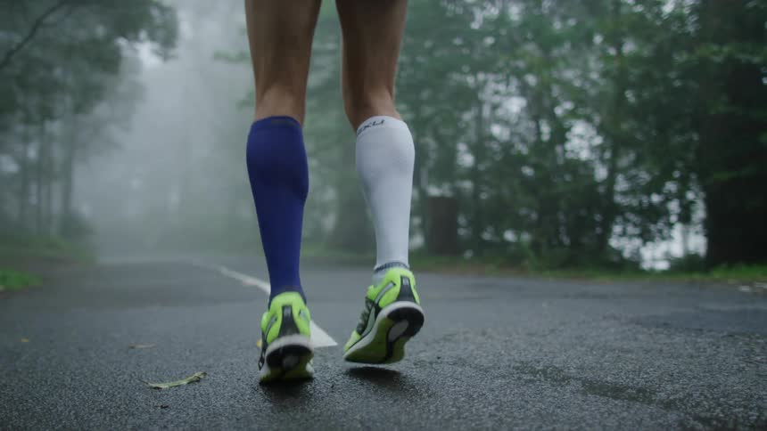 A person is jogging in place on the road
