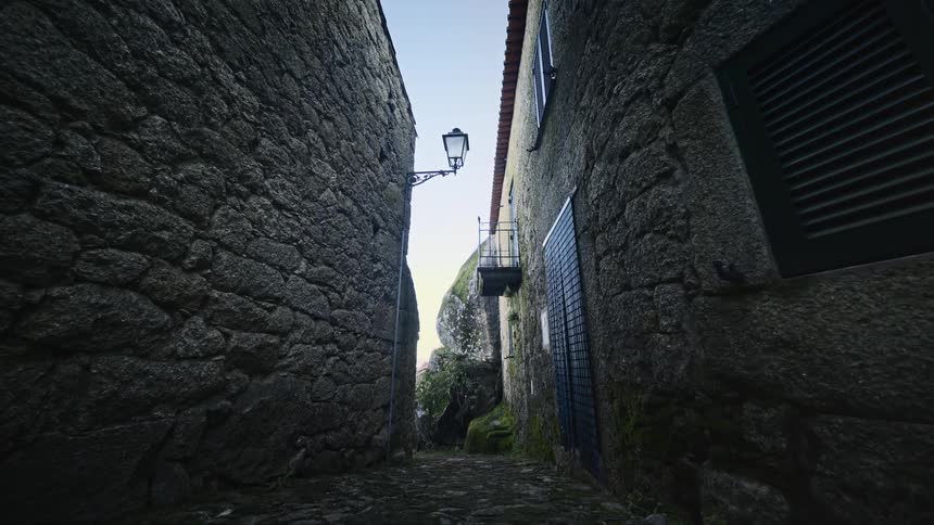 An alley between stone buildings on the street