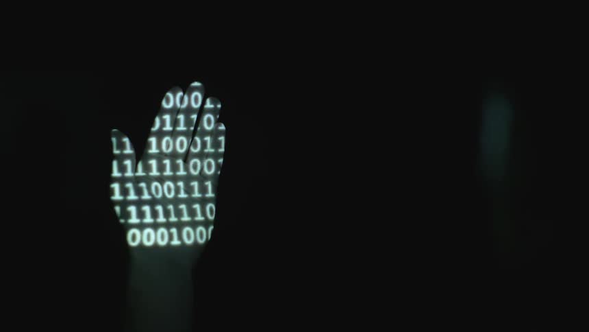 Binary shines on a person's hand