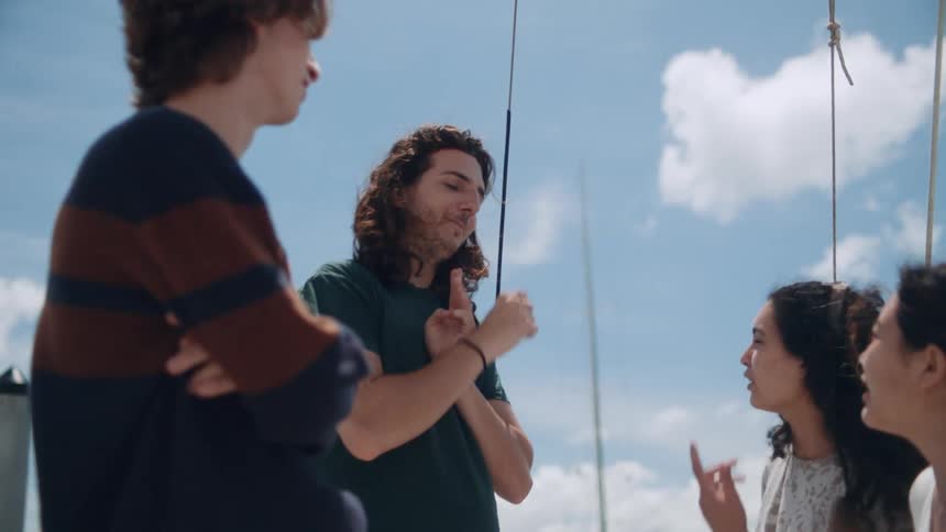 A group of friends talks to each other on boat