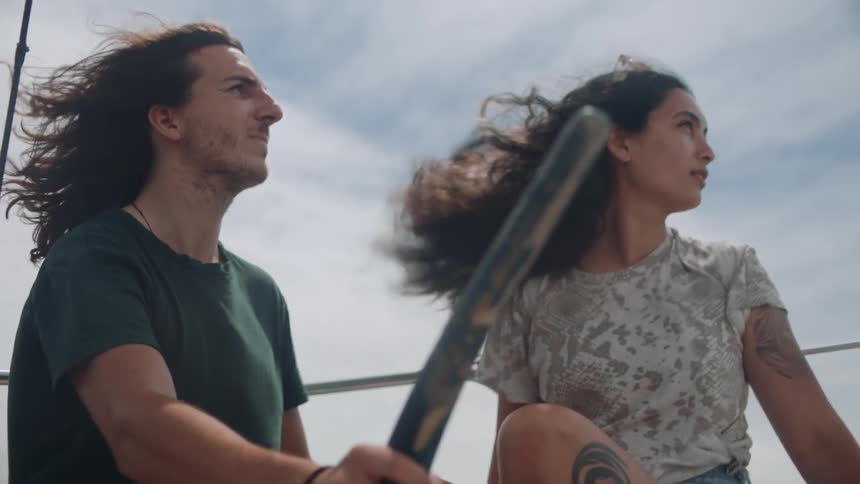 A man and woman are traveling on a boat