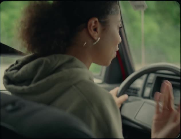 A woman argues as she drives
