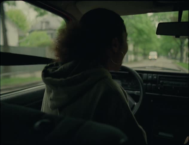 This is an intense and emotional scene of a lady driving a car while angrily talking to the man seated beside her