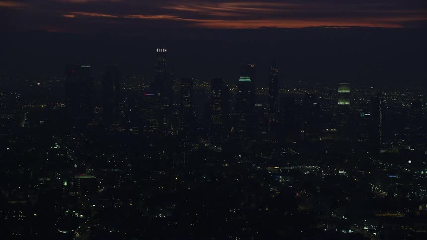 A breathtaking aerial view of towering skyscrapers in Downtown Los Angeles during sunrise