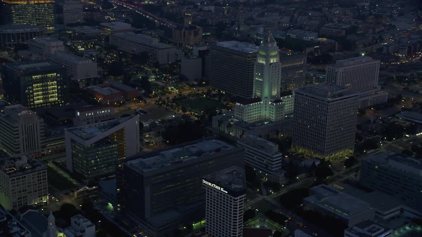 Aerial footage of Downtown Los Angeles City Hall and government buildings during sunrise in Southern California