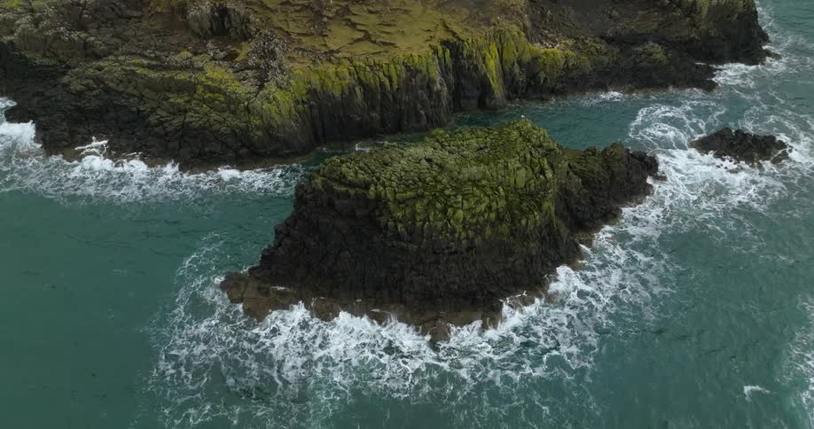 A majestic mountain rising up from the sea floor like a mythical island in the water
