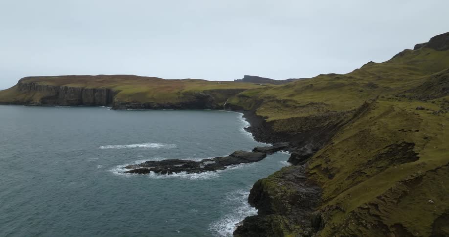 Aerial view of rocky seaside land covered in moss