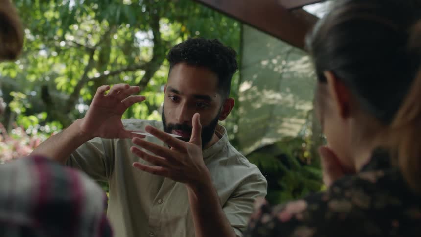 A man is doing magic tricks for people