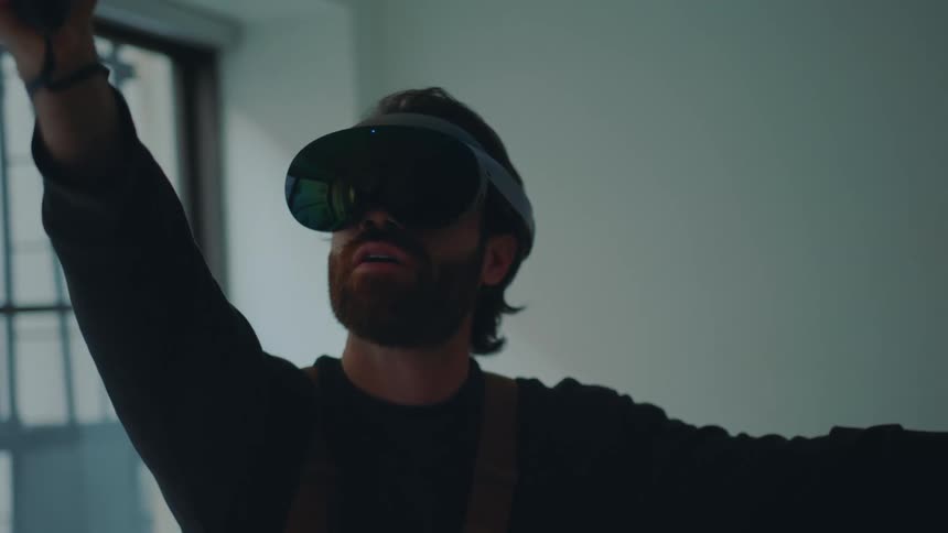 A male is playing a virtual reality game by himself
