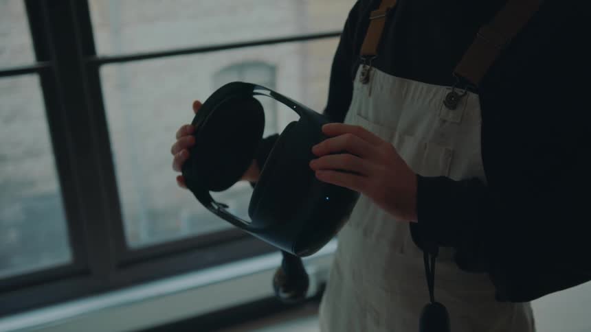 A man looking at a vr headset