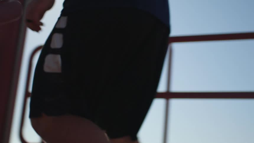 A man running up stairs outdoors