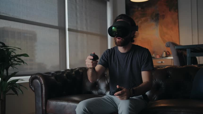 A man is using a virtual reality headset