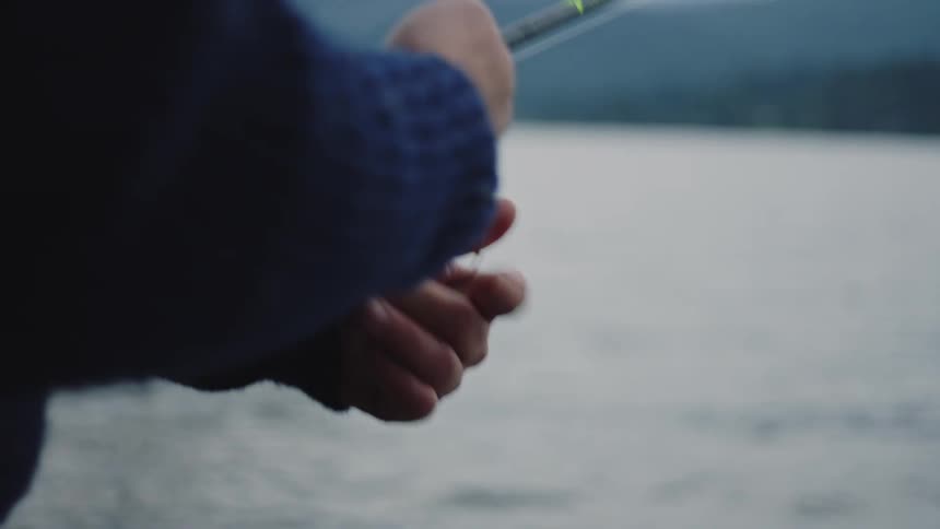 A person is fishing in the lake