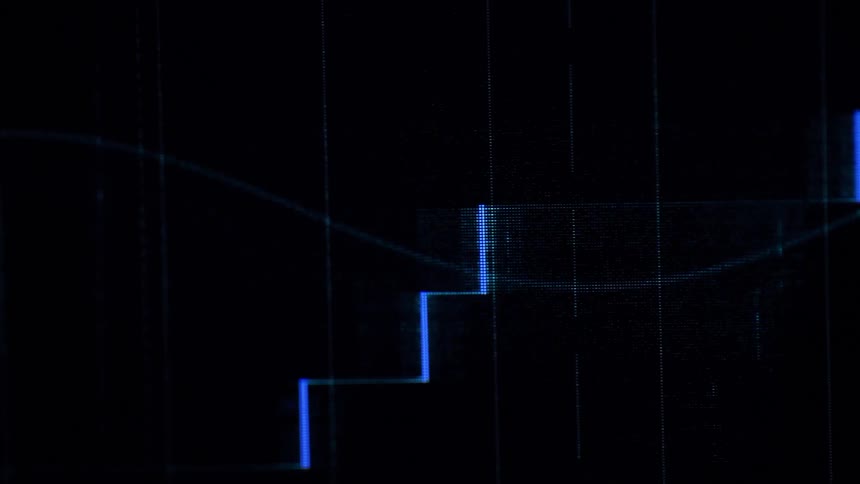 Glowing blue lines on a graph move across a dark screen