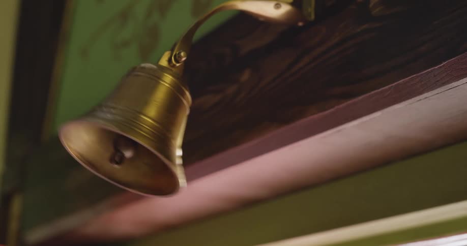 The door hits the bell as it opens