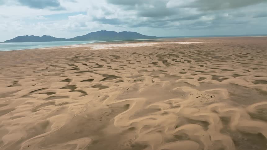 The sand leads to the water