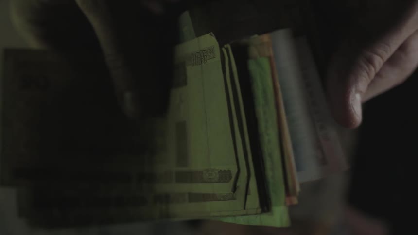 A person flips through money