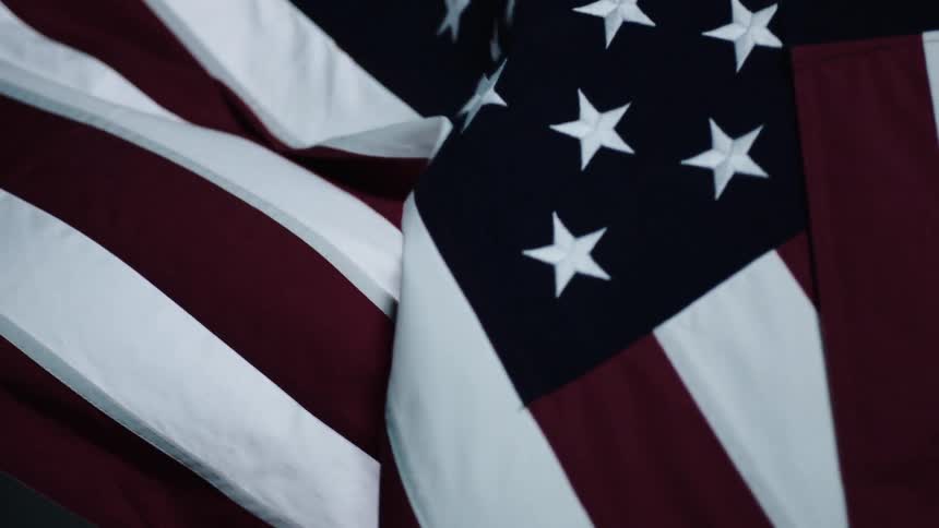 An american flag billows in the wind