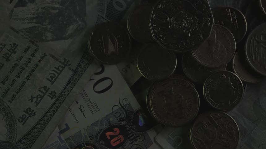 Coins and bills are all over the ground