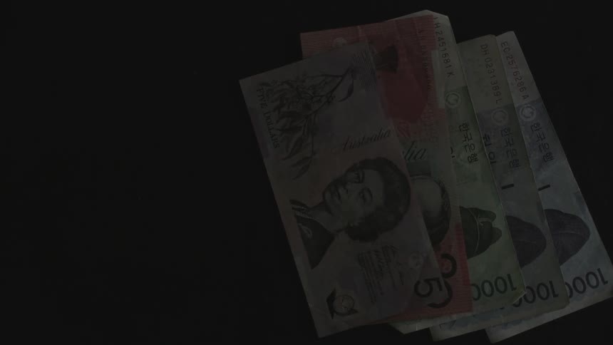 A man laying currency on a table
