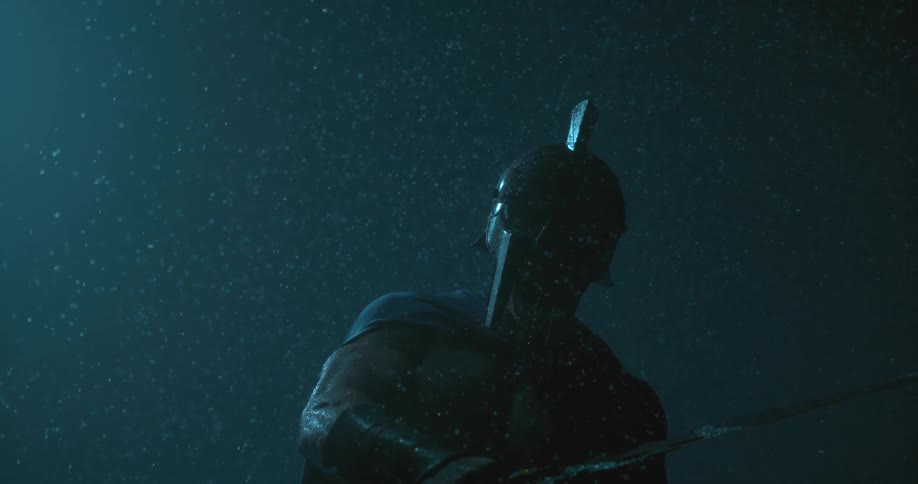 A man swings his sword in the rain