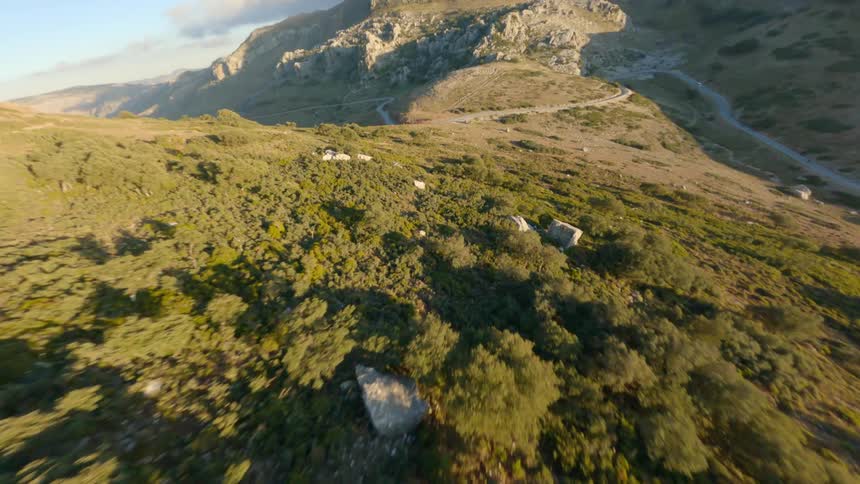 Aerial view of rocky hill and hill slope with rocks and bushes
