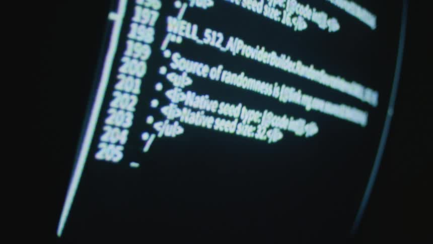 Monitor that has coding scrolling through it