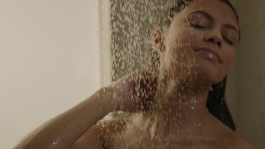 A woman is taking a shower