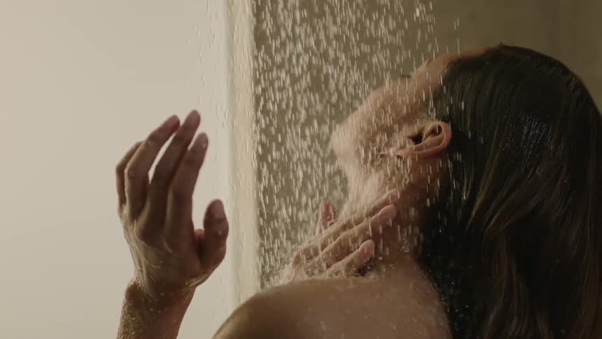 A woman is taking a shower
